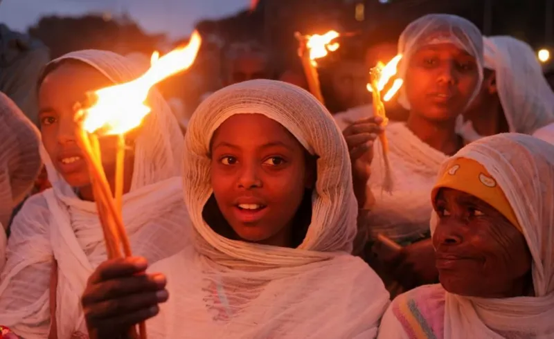 Ethiopia festival fires burn bright despite downpour